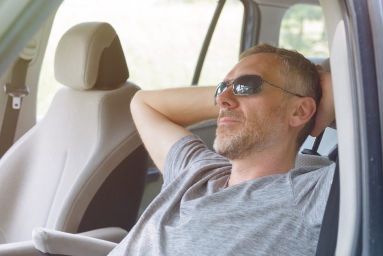 man relaxing in the car